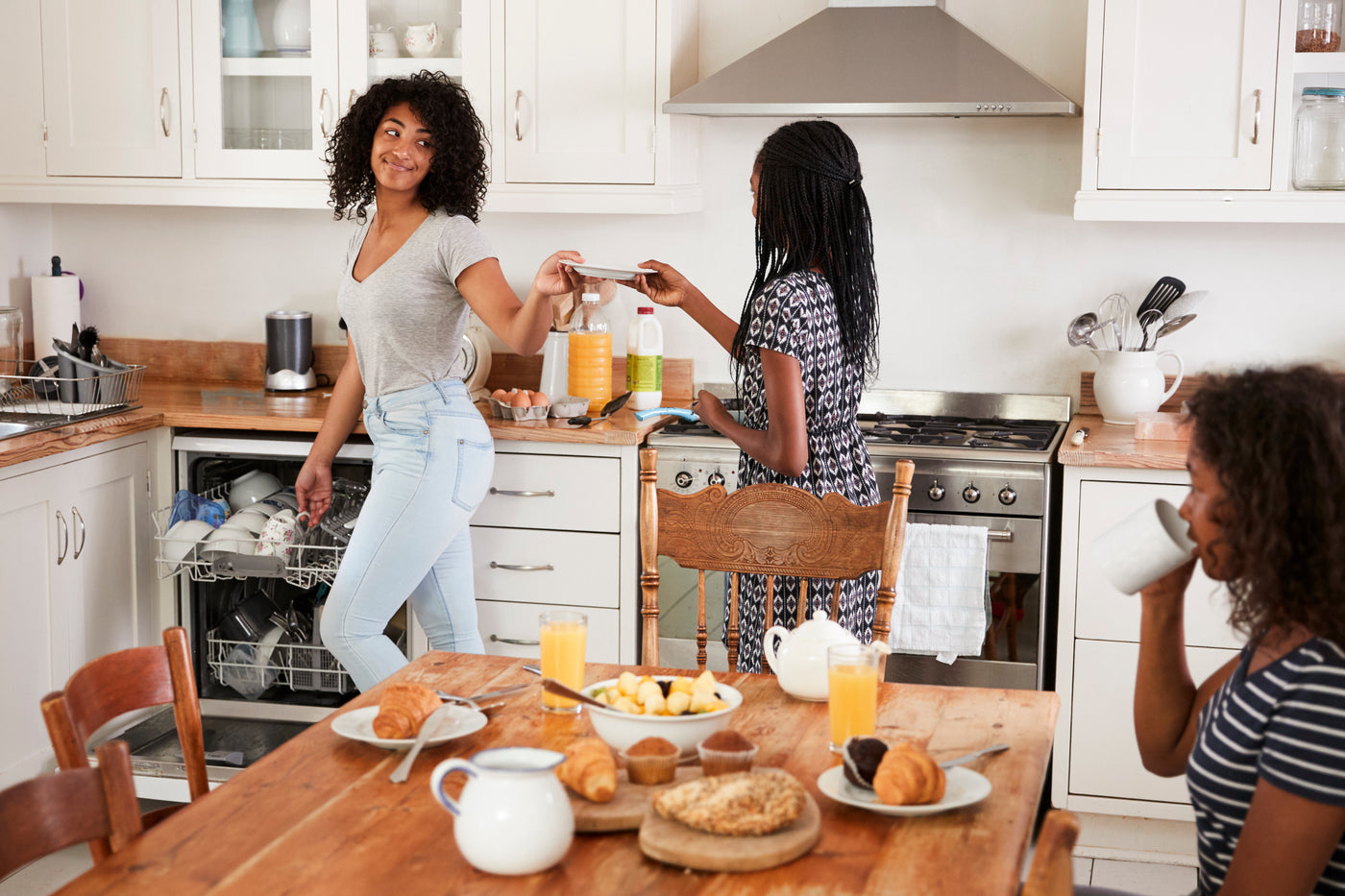 A family enjoying breakfast together thanks to their kitchen appliances