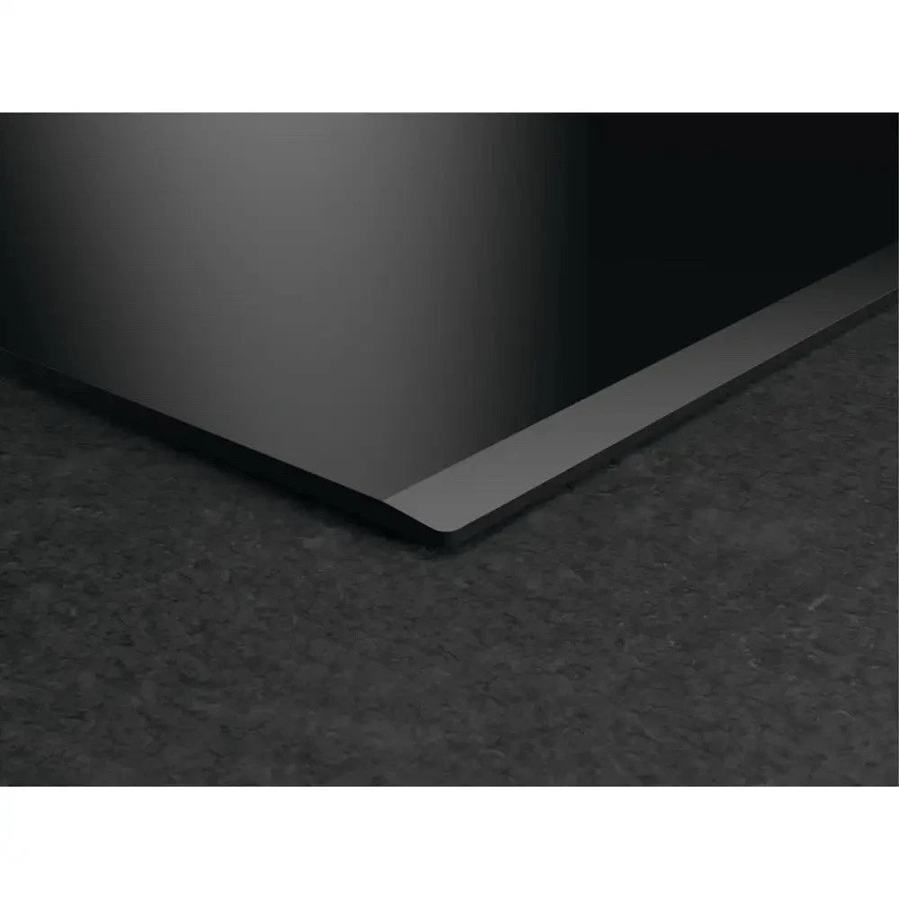 AEG Series 6000 TH84CB03FB 81cm Induction Hob with Venting Extraction in Black - A+ Rated - HW181702-03 from HomeWise Appliances. Stock Photo showing bevelled edge of the hob.