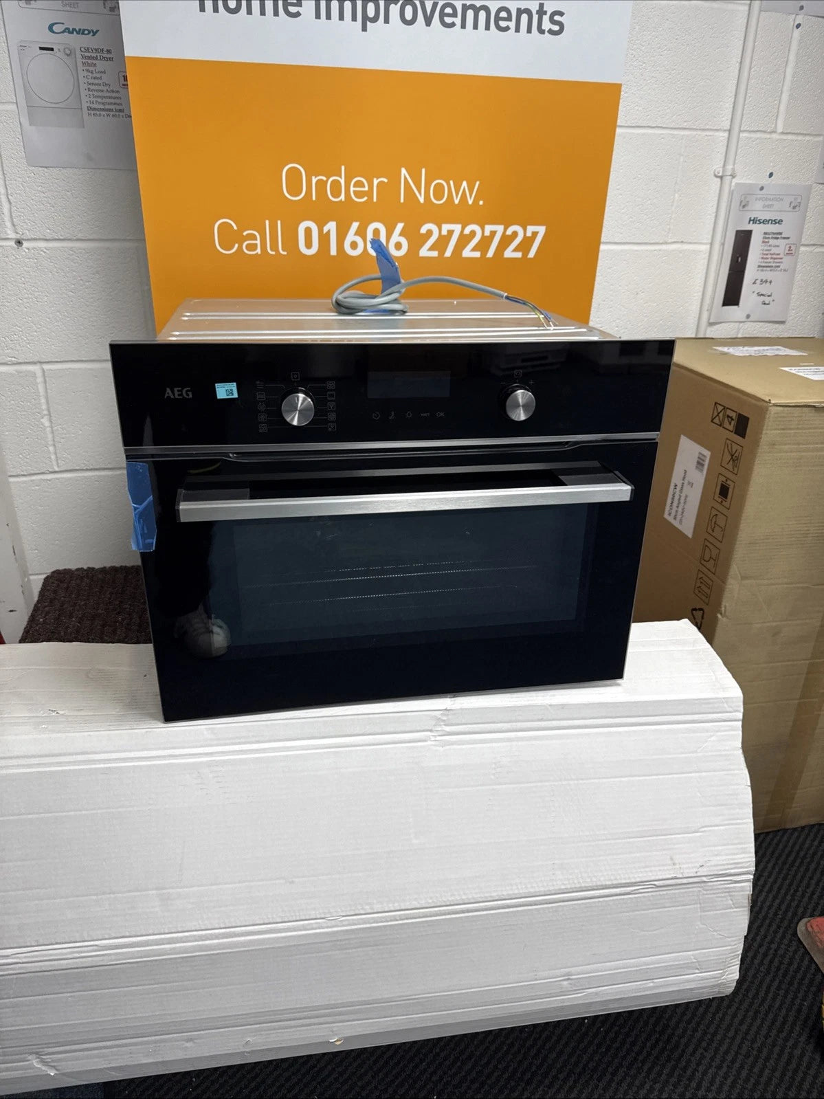 AEG 6000 Series GK6NK401B Combi Quick Compact Built-in Combipnation Microwave Oven in Black from HomeWise Appliances. Shop photo front of the appliance.